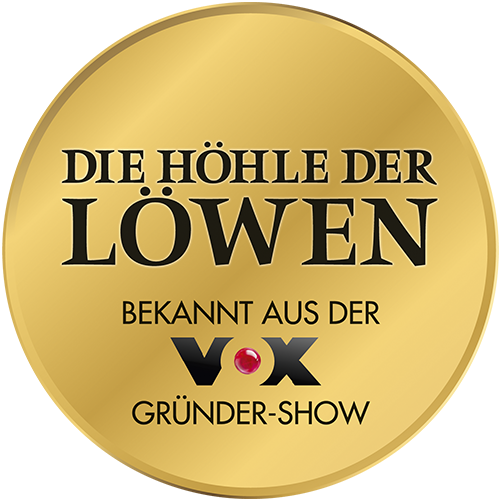 Goldener runder Siegelsticker mit schwarzer Aufschrift "Die Höhle der Löwen", darunter "Bekannt aus der VOX Gründer-Show" und VOX-Logo mit rotem Punkt.